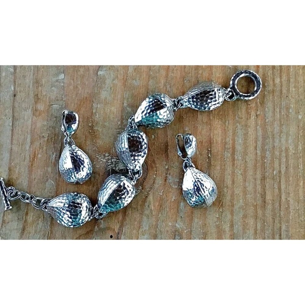 Avon bracelet and clip on earrings hammered silver tone set
